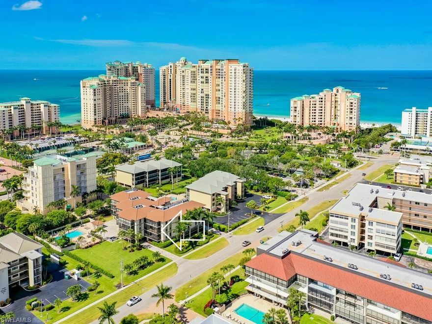 Location, updated, and spacious!  Check out this large 1394 sqft 2 bedroom 2 bath condo walking distance to South Beach and restaurants on the south end of Marco Island. This updated 2nd floor end unit offers a living area that is tastefully furnished with comfortable seating and features large windows and sliders that flood the space with natural light. Whether you're unwinding after a day at the beach or hosting intimate gatherings with friends, this versatile space is sure to meet your needs. Other features include a newer kitchen counter with breakfast bar and back splash along with new matching stainless steel appliances (refrigerator, stove, dishwasher), updated light fixtures and faucets throughout, tile flooring, impact windows, newer washer and dryer, and 2019 AC. Community amenities include covered parking, large pool, beautifully landscaped grounds, club house, BBQ area, bike and extra storage. Don't miss out on this fantastic opportunity to own your own piece of paradise!  Give us a call today to see it in person.