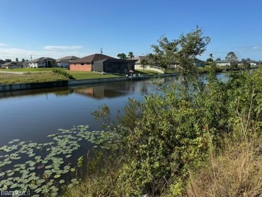 Rare opportunity for families wanting to live near each other or builders looking for convenience. Three waterfront lots next to each other are available. Sellers prefer to sell all three to a single buyer. The other two lots are 1024 NE 12th St and 1020 NE 12th St. Build your dream home on this southern exposure, wide freshwater canal lot in Northeast Cape Coral. This lot is located near many new homes and is close to Fort Myers and Punta Gorda so your entertainment options are endless. The lot is on the Bal Moral Canal with direct access to Lake Zurich for water enthusiasts. Nearby schools, shopping, dining and recreation make this an ideal location. Water, sewer and irrigation are already in place.