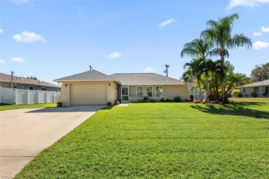 This stunning single family home in Cape Coral is looking for a new owner. Boasting 3 bedrooms and 2 bathrooms, this updated home features stainless steel appliances, LVP flooring, quartz countertops, and hurricane windows for added peace of mind. NEW ROOF in 2023 and AC in 2022, ensuring that you can move in worry-free and enjoy all the comforts of a newly renovated space. The 1.5 car garage with epoxy flooring provides ample storage space, while the large spacious back patio under roof is perfect for entertaining guests or simply relaxing in the Florida sunshine. Plenty of room to add a pool design of your choice in the fully fenced in backyard. Whether you're a first-time home buyer looking for a stylish and move-in ready property, or someone looking to downsize without sacrificing quality, this home is sure to impress! NO FLOOD ZONE. Don't miss out on the opportunity to make this beautiful house your new home sweet home- just bring your belongings! Schedule a showing today and experience the best that Cape Coral has to offer in this charming and updated residence. Close to Fort Myers, shopping & restaurants!