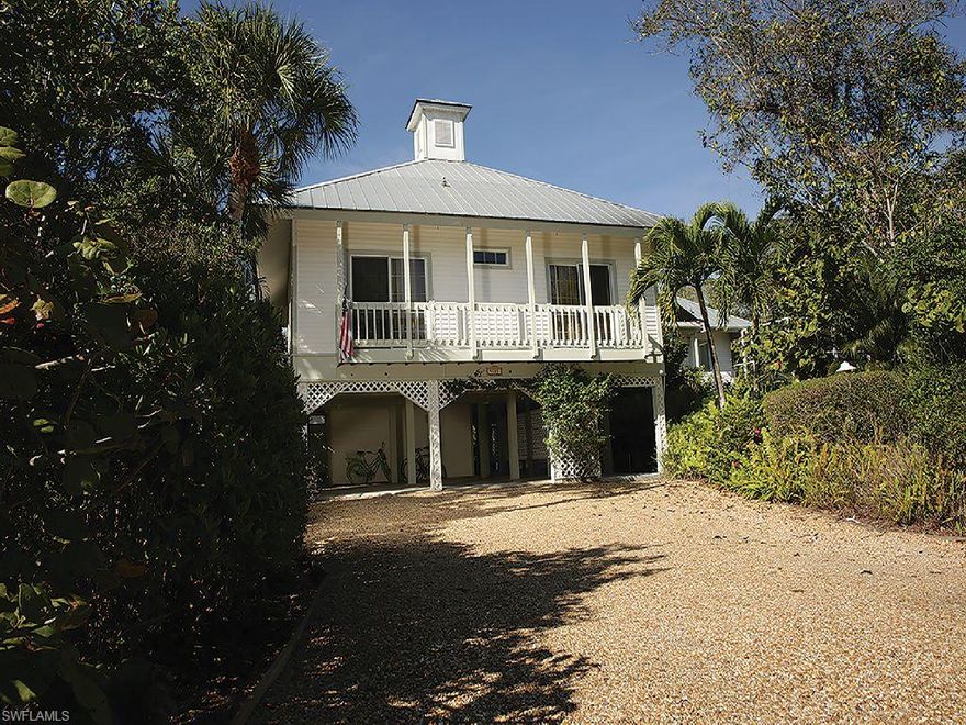 Original architectural design is the hallmark of this lovely lakefront home. Features an expansive Monticello-style living area with sweeping water views. Fully remodeled kitchen with cherry wood floors, stunning granite and top of the line cabinetry, washing machine and dryer, and lighting. Lap pool and spa ideal for swimmers. 3 bedrooms, 2 bathrooms and over 2,800 square feet of living area. New dock for kayaks and canoes, new heating/AC unit, new water heaters, renovated guest bathroom, enhanced landscaping. Large parcel of property and classic house well-maintained by owners.