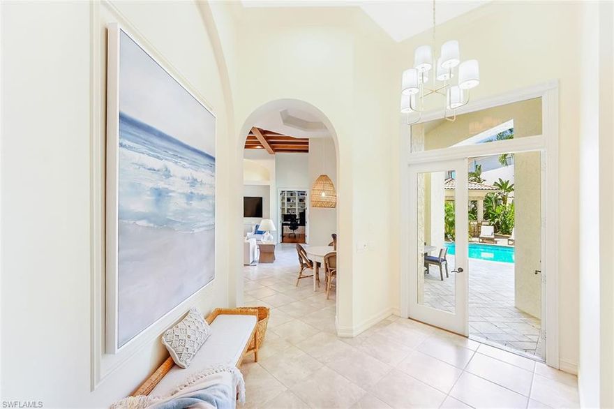 This FABULOUS, FUN, COASTAL courtyard home with a Guest House is located in the North Naples guard gated, amenity-rich community of Pelican Marsh.  The first floor living space offers two expansive great rooms - one with a living area/tv/ bar and dining space for 10, and the other adjoining the kitchen bar and breakfast nook with another TV and sliding glass doors that open to the lusciously landscaped heated pool area. The first floor Primary Bedroom suite includes a king bed, a large walk-in closet and its own double doors to the pool area.  The ensuite bath is spacious with his and hers vanities, a soaking tub and a walk-in shower. If you must work, the classic den with wood floors and built-in shelving is a perfect spot with a large desk and monitor.  Upstairs, you will find 2 additional bedroom suites with full baths, as well as a cozy loft area. Across the pool deck and next to the covered grill area, you will find a Guest House with a king bed, full bath with a large walk-in shower and a convenient morning kitchen.  The Pelican Marsh community offers a very active TENNIS and PICKLEBALL center, as well as miles of walking paths, a state-of-the-art fitness center, Yoga, Pilates and other fitness classes. Located just a few miles from Vanderbilt Beach and Wiggins Pass State Park, you're also adjacent to Mercato featuring Whole Foods Market, great restaurants, shops, a movie theater, and live entertainment. So much to do, so little time...