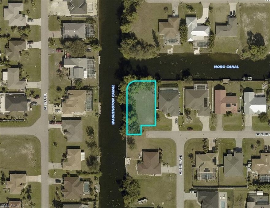 **WATERFRONT LOT with CITY WATER & SEWER** Utility balance have been paid -- no assessments! Experience waterfront serenity in the stunning setting of Cape Coral. This peaceful lot, located in the heart of SE Cape Coral, offers the perfect canvas for building your dream home. Nestled near Pine Island Rd and Santa Monica Blvd., the property provides both tranquility and easy access to city conveniences. Completely cleared and spacious, the lot invites endless possibilities for your custom home design. Enjoy the nearby city boat ramp, giving you direct access to the Gulf for boating adventures and relaxation. With grocery stores close by and the waterfront restaurants waiting to be explored, you'll have everything you need within reach. Whether you're looking to invest or settle down, now is the ideal time to claim your piece of Cape Coral's waterfront paradise. Don't wait—embrace the waterfront lifestyle today!