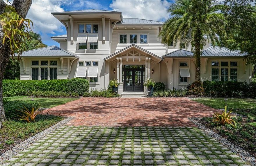 A rare opportunity to live on one of the most coveted streets in Old Naples in this beautifully crafted London Bay home that features exceptional finishes and detail throughout. The first floor offers a luxurious bedroom suite, a refined private study with custom built-in cabinetry and impressive primary suite that features a spa like bathroom with radiant floor heating, two walk-in closets and direct access to the custom pool and infinity-edge spa. Expansive accordion glass doors seamlessly connect the main living areas with stunning outdoor destinations, complete with a fireplace, fire pit, dining area and fully-equipped outdoor kitchen with roll down screens and storm shutters. Take the open light-filled staircase or private elevator to the second floor where you'll find two generous bedroom suites and well-appointed bonus room that opens onto a balcony overlooking the lushly landscaped yard. Additionally, guests can enjoy the private cabana with a lookout balcony situated above the air-conditioned three-car garage. This remarkable property is located just steps away from the beach and is in close proximity to all that downtown Naples has to offer.