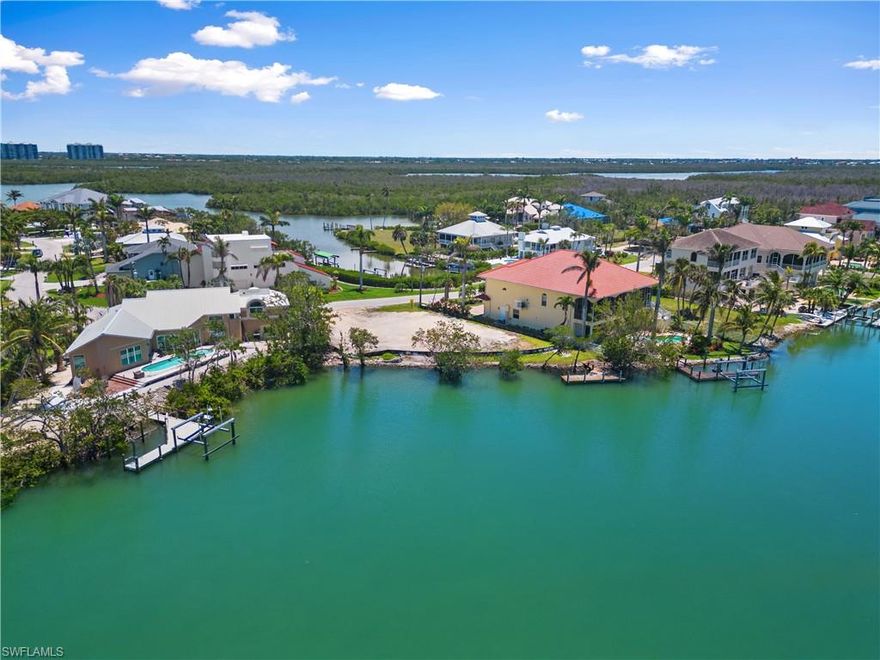 Discover an exceptional opportunity to create your dream home in the coveted “Carolands” neighborhood! Nestled in a peaceful & quiet community with NO HOA fees, this spectacular Gulf-access lot boasts an impressive 142 feet of water frontage, offering the perfect blank canvas for your coastal paradise. Enjoy a leisurely 5-minute boat ride to the Gulf of Mexico and a short walk across the boulevard to the sugar sands of Bonita Beach. This lot is a haven for beach lovers and boating enthusiasts, featuring deepwater access suitable for sailboats and a spacious boat dock. Boasting highly sought-after Western exposure, you will be able to experience endless sunsets over the beautiful bay & serene Gulf from the upper levels of your future home. The Carolands on Bonita Beach is home to many luxury residences including homes on Bonita Beach that have sold for nearly $12 Million in 2023! Perfect opportunity to build your home to your exact specifications & desires with all the newest building codes. Fantastic location near many top-rated local restaurants, close to the Promenade, Coconut Point Mall & Mercato, with easy access to RSW International Airport.