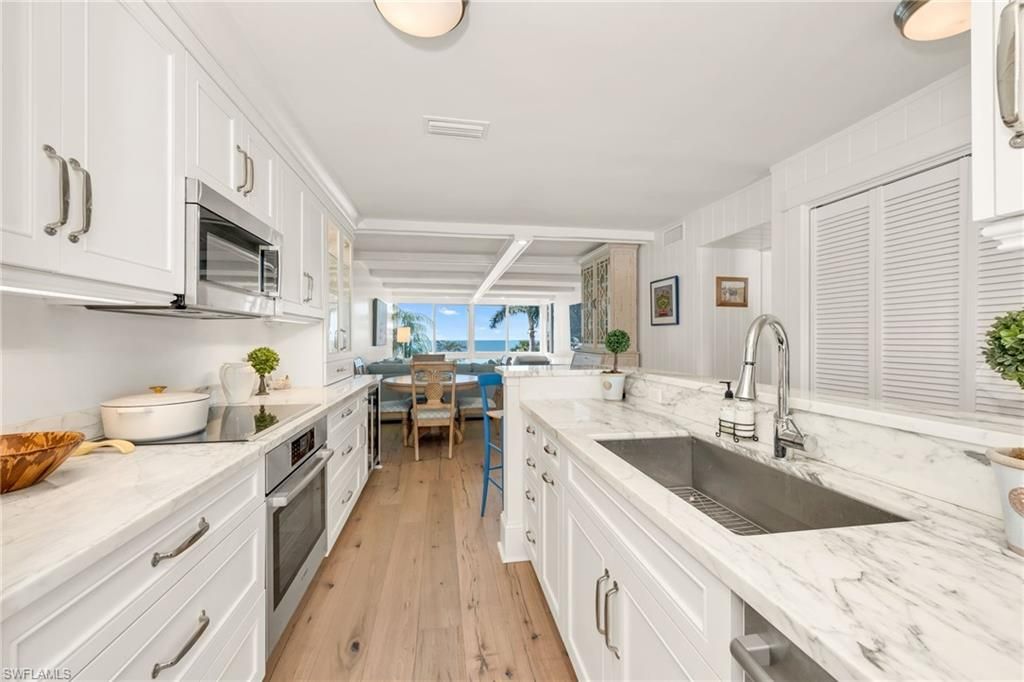 Photo of 2121 Gulf Shore BLVD N #206, NAPLES, FL 34102 (MLS # 225072917)