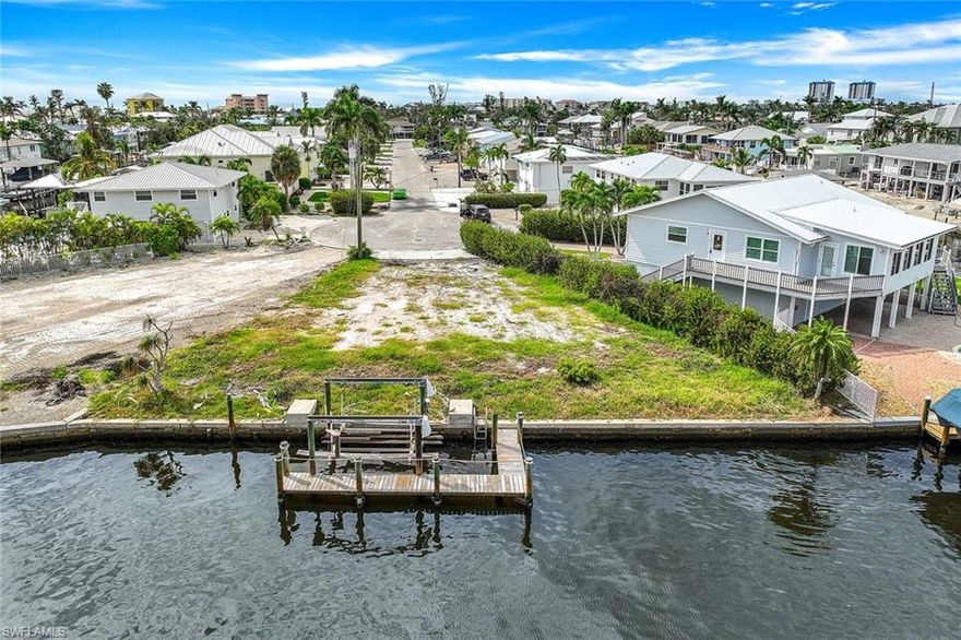 This extremely rare and unique property featuring 0ver 100 feet (combined with lot 18 is over 200 feet) of water line on a quiet cul-de-sac with gorgeous bay views is now within your reach. Purchase separately or as a package of 2 properties with lot 18 next to it, to build your waterfront island home (or two if you wish) on these oversized canal lots with combined size of .37 acres and easy beach access right around the corner. Lot 18 has boat lift with dock and a grandfathered boat house with metal roof while the open air boat lift has a secondary spot for jet skis as well as a boat. 20 has a separate boat lift with dock. 20 also has a view of the back bay. The possibilities are endless here, only your imagination is needed.