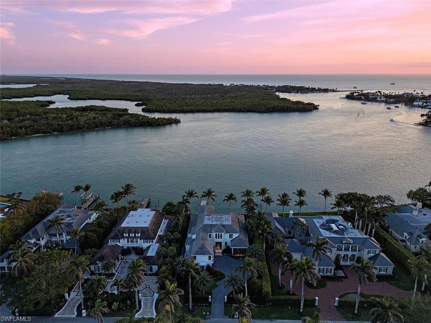 This extraordinary, fully furnished Port Royal estate is a true masterpiece of luxury, boasting panoramic southern views
stretching across Admiralty Bay to Keewaydin Island, with captivating glimpses of the Gulf. Built by London Bay Homes,
designed by Kukk Architecture, and interiors curated by Romanza Interior Design, this world-class team has created a
residence that embodies sophisticated coastal elegance. The home features an open great room floor plan, and a chef’s
dream kitchen at the heart of the home, with a freestanding breakfast island, adjacent bar and extensive wine storage.
The primary wing features a private study, offering a tranquil retreat. A staircase or private elevator leads to the upper
level, where an upstairs bonus room with private balcony is surrounded by a VIP guest suite and additional bedrooms.
Pocket glass doors seamlessly connect indoors to an exquisite outdoor living space. A covered lanai with gourmet
summer kitchen, sleek wood deck with lounge seating, and a mesmerizing fire table set the stage for unforgettable
gatherings. The zero-edge custom pool and spa enhance the home’s serene ambiance. This property is eligible for Port
Royal Club membership.