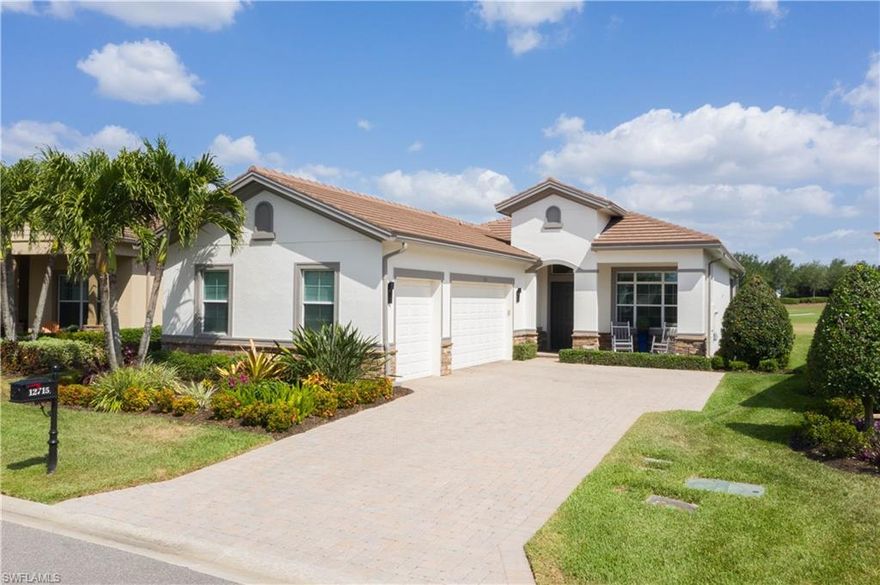 This beautiful GOLF COURSE home is loaded with custom upgrades.  It features 3 bedrooms, 2.5 custom designed bathrooms, an open floor plan with modern up-to-date light fixtures and ceiling fans.  Elegantly appointed, this could be your dream home...it's move in ready and every "i" has been dotted and "t" crossed.  It has a THREE CAR ATTACHED GARAGE, impact windows and an electric hurricane shutter.  Step out to the extended lanai and enjoy a state-of-the-art custom outdoor kitchen,  stunning wood ceiling,  heated pool/spa and a gorgeous view of the GOLF COURSE.   This is paradise at its best and Verandah has created a wonderful lifestyle with two 18-hole championship golf courses, tennis courts, a state-of-the-art fitness center, a community pool, pickleball and bocce ball courts. For those who love outdoor activities, how about venturing out and KAYAKING on the adjacent ORANGE RIVER or going for a nice bike ride or walk on the 9+ miles of trails? Verandah is conveniently located to Downtown Ft Myers, the Caloosahatchee River, and both the Ft Myers and Punta Gorda Airports. This one is a winner!