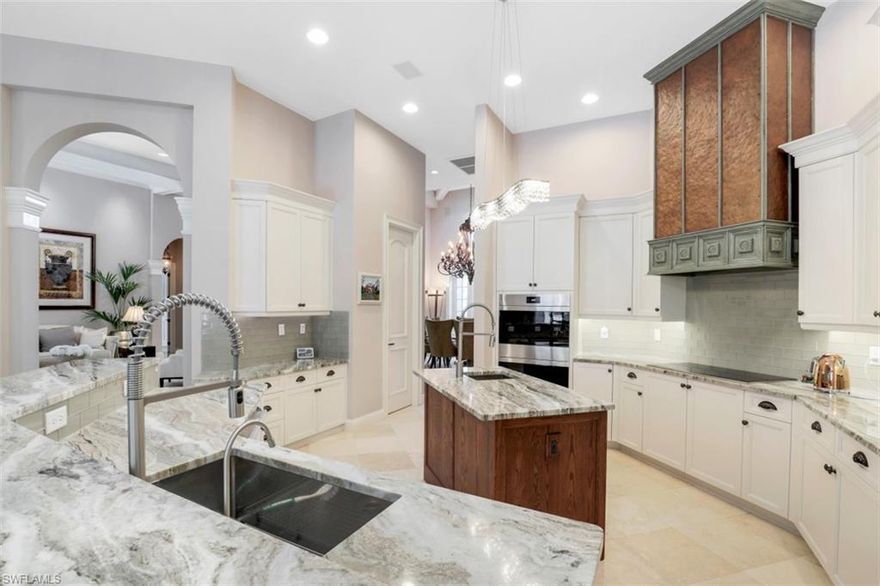 H5193. Perfection Plus from this Turn-Key Furnished Masterpiece built by Kingon Homes. This custom estate home is nestled in the private Bay Creek Estate community within Pelican Landing. This is a “One of a Kind” location peacefully located on Spring Creek River that flows out to the Gulf of Mexico. Enjoy kayaking & canoeing from your back yard or simply enjoy the wonders of dolphins, manatees & birds perched in peace. This Estate home offers 4 En-suite Bedrooms, Den, the Master Grand Bedroom suite has a spacious newly built reading room off the master with beautiful post and beam craftsmanship and oversized closet. Quality that suits your style of living. All the spaces to share and entertain in this spectacular home open to your oversized resort lanai with summer kitchen, pool, spa, fireplace & private setting. Owner has taken impeccable care of this home and it shows.  Recent enhancements include pool renovation with LED color changing lights, whole house generator, refreshed kitchen with new appliances, new air conditioners, master bathroom renovated, master bedroom custom closet (must-see) & more. DESIGNED FOR ENTERTAINING...this home has all your "I wants" and a "WOW" lanai!