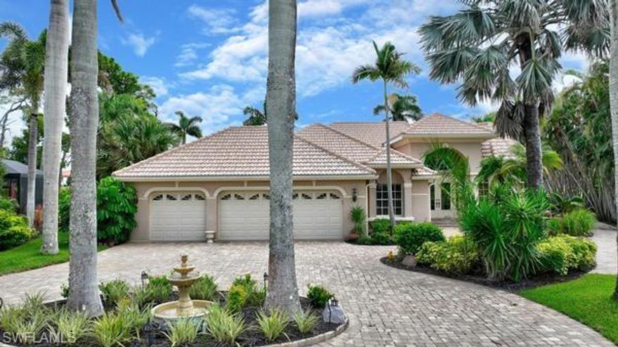 This home is located in the exclusive community of Admirals Point in the largest Florida west coast marina called Burnt Store Marina.  The home sits on over one-half acre of meticulously maintained landscaping which features 15 Giant Royal Palms along with over 25 Foxtail Palms.  One of the greatest features of the home is that you own the land the home sits on.  You are not a part of a sub-community where there are community rules to follow, other the master association, and no monthly fees to pay.  The entry to the estate is on a cul-de-sac with a circular driveway featuring an island with a fountain.  The home has a large 3-bay garage with hurricane rated 195 mph doors with windows.  Upon entry to the home through double lead framed windows, you will be at awe when you see the beauty of the professionally designed one-of-a-kind home.  Interior features include a private dining room with a vaulted double tiered lighted ceiling and a Butler's entry to the kitchen.  The recently updated kitchen has GE  Slate appliances, Quartz counters, and towering planter shelving.  There is also a hanging tower over the bar that seperates the kitchen with the great room.  Your eyes will immediately focus on the most unique feature of the home, that being an atrium which is landscaped with tropical plants surrounding a pond with a fountain.  The atrium has a screened opening in the ceiling to allow natural light along with rainfall to replenish the pond.  The home has a large primary bedroom along with two additional bedrooms at opposite ends of the home.  Adjacent to the great room are pocketed sliders leading to the massive lanai/pool are encompassing 2165 square feet of tropical beauty overlooking a lake and golf course views.  The home also has a 4" casing well for irrigation purposes which eliminates paying for the community irrigation water source. 
Centrally located in the marina, the home also adds a great deal of privacy in that while sitting in the lanai, you cannot see a neighbor's home on either side.  Burnt Store Marina  lies on the eastern coast of Charlotte Harbor. In that Charlotte Harbor is the second largest estuary in the State of Florida, coupled with its proximity to the Gulf of America, it's no surprise that Burnt Store Marina is a mecca for boating and fishing enthusiasts. Whether your pleasure draws you to family fun cruising, speed boating, sailing, world class fishing, or dolphin and manatee sightseeing excursions, there is truly something for everyone to enjoy on the water. In addition, there are many amenities that include a fitness center, tennis, pickle-ball, swimming pools, world class fishing, a private yacht club, along with waterfront dining.  These are a few of the many treasures that await you.  Imagine living in a community with a lifestyle where
yachters and nature enthusiasts mingle with golfers and tennis players to create a buzzing neighborhood of residents, each of whom is proud to call Burnt Store Marina their home.