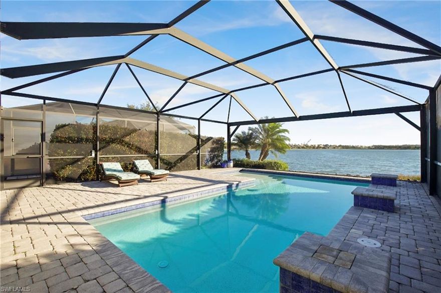 Live like you are on vacation every day in the resort-style community of Corkscrew Shores in Southwest Florida. Enjoy panoramic pool & water views overlooking the 240-acre sparkling Big Lake with sensational, unobstructed vistas. Indoor and outdoor living (1888 sq ft total) seamlessly blend as you step onto the covered patio, offering ample entertaining space within the screened lanai featuring a custom pool with cascading waterfalls. Easy living awaits in this 2–3 bedroom, two-bath home, sold fully FURNISHED and ready for you now. The open floor plan includes tall ceilings, white cabinetry, crown molding, tile flooring in the main gathering areas, and an attached garage. The gourmet kitchen offers an oversized island with seating, abundant cabinetry, and generous storage. The owner’s retreat showcases water views and a spa-like bath with dual sinks and a walk-in closet. No club fees or CDD tax. Not in a flood zone. Amenity island overlooking the 240-acre lake features a zero edge pool with fountains, spa, indoor/outdoor restaurant and bar, and firepits. Enjoy kayak and canoe launch, fishing pier, non-gas boating, 24-hour state of the art fitness center, movement studio, basketball, tennis, bocce, ping pong, and pickleball courts, playground, picnic area, and scenic nature trails. Conveniently close to FGCU, RSW Airport, Hertz Arena, open air shopping, and dining.