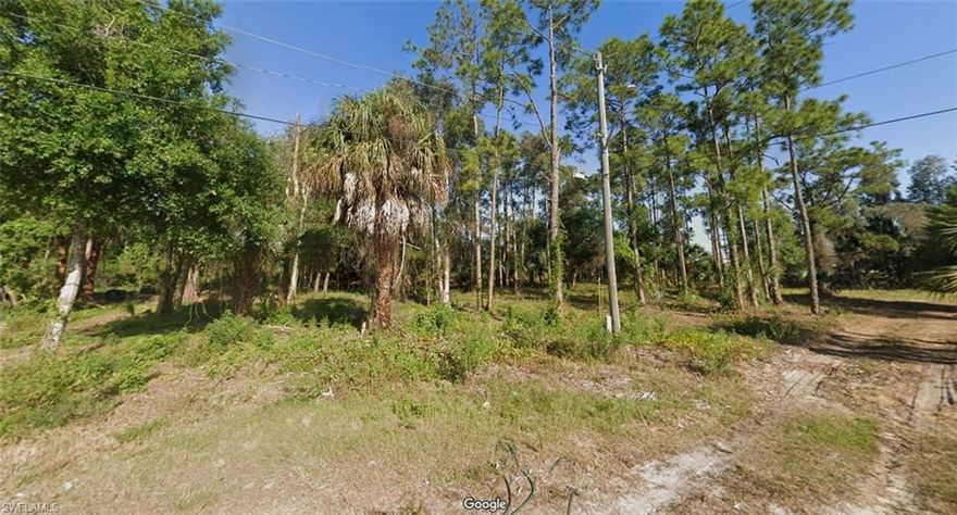 Discover the perfect blend of serenity, freedom, and strategic accessibility with this expansive .88-acre double corner lot in Lehigh Acres. Ideally situated away from flood zones and just a stone's throw from Route 82, this unique parcel sits on a canal and offers the rare opportunity to subdivide into two separate buildable lots. Experience the best of both worlds: the privacy and spaciousness that comes with rural living, paired with convenient access to modern-day amenities. Whether you're looking to cultivate a garden, park an RV, or simply breathe easy, this lot provides a versatile canvas with zero restrictions. It's your gateway to a lifestyle unbounded by the constraints of city living.