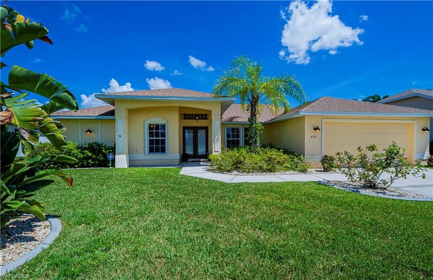 Welcome to your new waterfront home in Central Cape Coral!This beautiful 2065 sq ft interior space single family home boasts 3 large bedrooms, 2 baths a 2 car garage,plus a office/den.Spacious and bright.The office space is perfect for working from home.The fresh water front location is fab to enjoy sunshine and taking in the beautiful views from almost all rooms. Kayak, boat, and fish from your large yard. Room for pool. Located near access to all the amenities the city has to offer, including shopping, dining and entertainment. Close to  schools too. The lanai is 26 ft. x 21 ft. New roof. Newly repainted interior,furniture negotiable. Quartz countertops,S/S appliances, wood look tile.Sea wall.
 Most rooms have a view of the  water. Must see, home looks almost new. The triple glass sliding doors in the living room open to the large lanai.The master bedroom and the family room with double sliders, also open onto the lanai. Kitchen opens to large family room overlooking the water. Room for a pool. Home has a letter of map amendment from FEMA. No flood required per FEMA. Make this open airy large home yours! Schedule a viewing today and experience this amazing property for yourself.