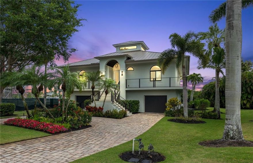 This home has it all! With 3 ensuite bedrooms on the main level, it is the perfect blend of luxury, functionality and breathtaking views. From the moment you step inside, the stunning bay view captures your attention, complemented by high-end features such as: Subzero refrigerator/freezer, subzero beverage drawers, Miele built-in coffee station, and warming drawer. Wolf oven and microwave. Fisher & Paykel double dishwasher. Custom cabinetry, Carrara marble counters and backsplash, pot filler and White oak plank flooring throughout! Pecky Cypress ceilings add charm in both the entry and dinette, new elevator, impact doors and windows with plantation shutters. The outdoor living area is equally as impressive with new cable railings and decking, new marble pool deck and outdoor kitchen. The finished lower level will “WOW” your visiting guests, with 2 bedrooms, a full bath, updated kitchen and appliances. Let’s not forget the amazing boat dock for all those toys to get you to the Gulf in 10 minutes. Plus, being just a short walk to Barefoot Beach adds an extra layer of desirability. It's definitely a home that offers both style and function in a fantastic location!