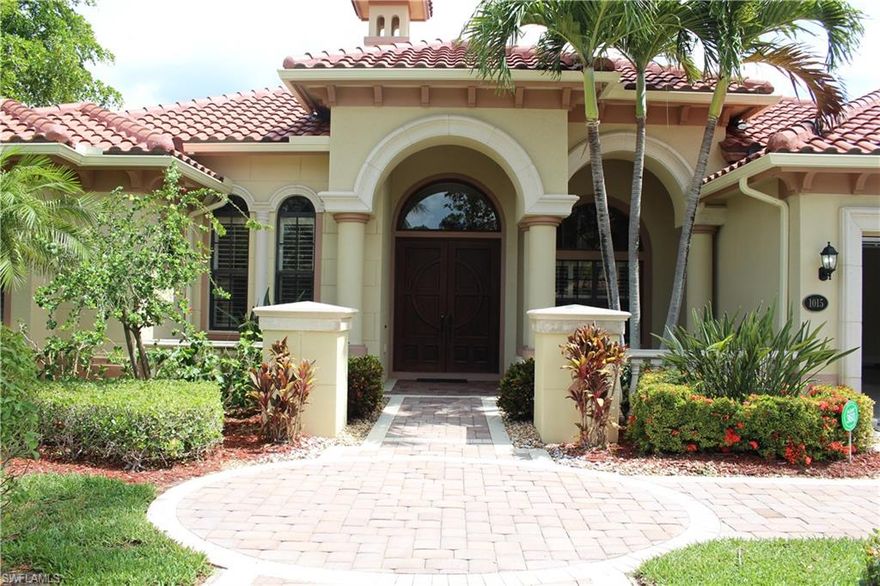 Beautiful Briarwood! This wonderful "In-Town" home has it ALL! Luxurious custom kitchen with Level IV 42" wood cabinetry, gorgeous granite and mitered glass in dinette and master. Extensive 18" porcelain in living areas, crown molding, 14' ceilings, new tile roof plus 2 1/2 car garage and large inviting pool and spa!  Over 650 sq. ft. of custom lanai --perfect for entertaining!  This lovely home is also on an oversize .30 acre waterfront site - Indeed - on the tranquil Golden Gate Canal, thus lovely wide-water views to enjoy!