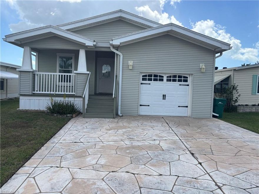 INCREDIBLY CHARMING, ONE OF A KIND MANUFACTURED HOME IN DESIRRABLE ENCHANTING SHORES COOPERRATIVE. THIS SWEET BUNGALOW STYLED HOME BOASTS A FULL FRONT AND BACK PORCH UNLIKE MOST MANUFACTURED HOMES AS WELL AS A 320 SQUARE FOOT ATTACHED GARAGE WITH AUTOMATIC DOOR OPENER. The flooring throughout the house is beautiful wood laminate while the bathrooms and kitchen are shiny ceramic tile. The kitchen is fully appliance and boasts a deep farm sink and recessed lighting, which extends to the open dining room and living room. The master suite has a large bathroom with double sinks and a walk-in shower as well as a walk-in closet. On the other side of the house, you will find a guest bedroom also with a walk-in closet as well as the main bath. The den in the front of the house can easily be converted into a third bedroom. The HVAC split system was installed in 2024 while the membrane roof is from 2018l. Enchanting Shores offers a scent of community that is extremely rare as well as amenities and activities two numerous to mention, including access to the Gulf of Mexico and boat storage for a nominal fee of $225 annually. Don’t miss out on this immaculate and special home. don’t miss out on this wonderful opportunity to own a piece of paradise.