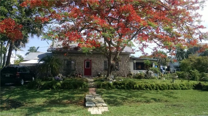 CORNER LOT WITH GULF ACCESS  first settler's  home in this wonderful peaceful quaint neighborhood . Family owned for several generations and built piece by piece from Coral rocks . Lots of history and love have passed through these doors but you can keep the rock structure or build YOUR own. 

Minutes to Wiggins pass right into the Gulf of Mexico.Only one bridge to cross ,same as Conners Vanderbilt access. Property is at the end of the street so therefore the waterway is a bit extended to accommodate a larger dock . See the survey stakes   Beautiful Royal Poinciana Tree adorns the front of the house and other exotic tree also is in front

SURVEY AND ELEVATION CERTIFICATE AND MARINE PROJECT PROPOSAL AVAILABLE   (31,550.00). APPROXIMATELY