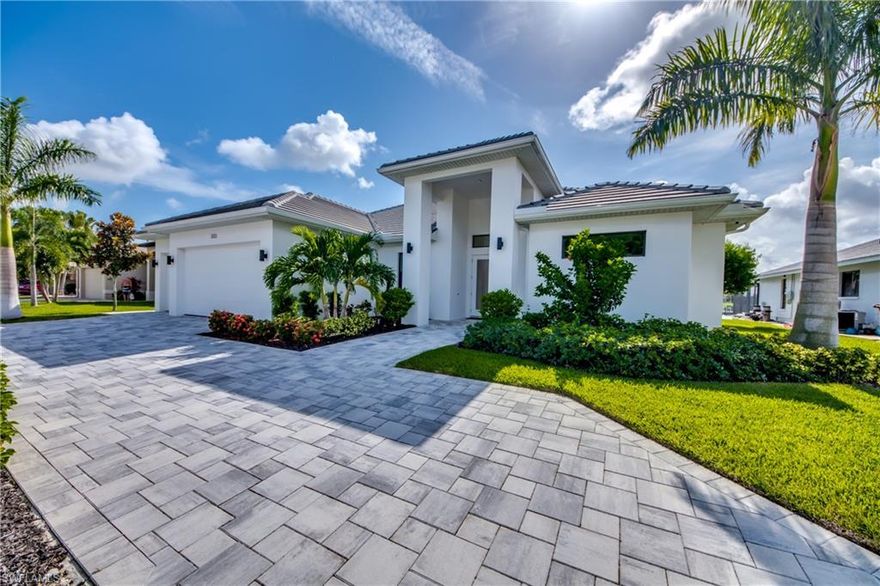 This contemporary custom built SMART Home, located at an unique intersection on Rubicon Canal with direct gulf access, is built in 2019 with quite a few beautiful details. You are overlooking a vast corner of intersecting canal. This dream home has a beautiful pool and spa area and a great outdoor kitchen with many amenities. The home features two suites, both located in the rear of the house, both offering stunning water views. The modern, white dream kitchen has a fantastic island and is built open, so you can create fabulous dinners while still being able to enjoy your family or guests. The home offers a 3/3 + Den, three-car garage, an outdoor kitchen, a pool area that will not disappoint and corner sliding doors to take advantage of indoor-outdoor living to entertain. If you are looking for a magnificent home in beautiful Cape Coral, this property has it all.