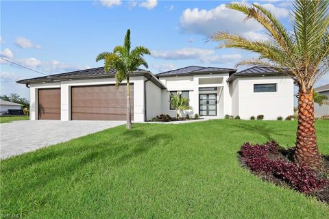 Photo of 909 SW 11th CT, CAPE CORAL, FL 33991 (MLS # 225042006)