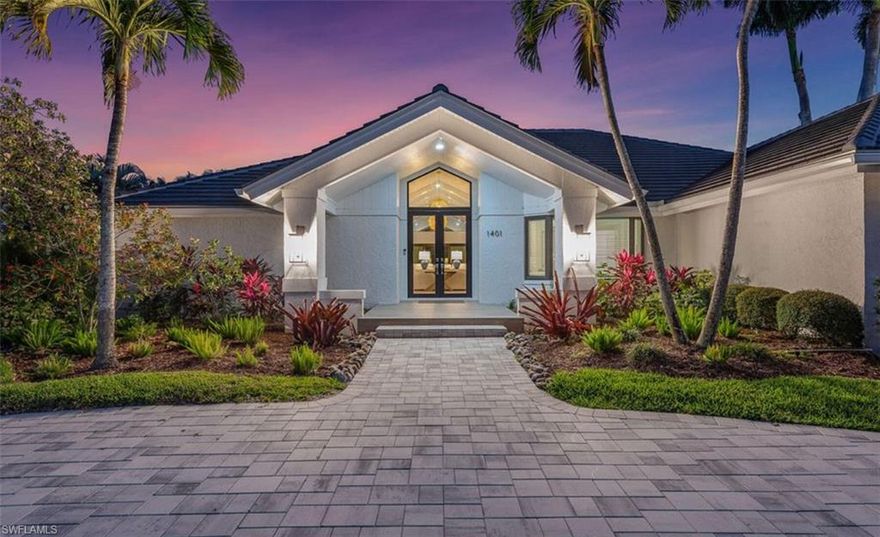 This exquisite residence, fully renovated in 2022, offers direct water access, popular southern exposure for all-day sunshine at the pool & outdoor living areas & a beautiful coastal furniture package. Perfectly positioned on an oversized half-acre corner lot in the prestigious Estates of Marco, the property boasts approximately 160' of seawall & direct Gulf access by boat with no bridges. The home showcases custom white cabinetry, custom closets & shades, all-new tile flooring throughout, new plumbing & lighting fixtures, plus fresh interior & exterior paint.  Designed with a light & airy coastal aesthetic, the open-concept floor plan features a large living area with a vaulted ceiling, double kitchen islands with lots of cabinetry storage space, 4 bedrooms & 3 beautifully updated baths.  Impact glass doors & windows provide peace of mind & abundant natural light.  The expansive south-facing lanai is ideal for entertaining, complete with roll-down screens & a spacious saltwater pool & spa. Relax in the shade or soak up the Florida sun while enjoying tranquil canal & long waterway views.  Boaters will appreciate the new dock & lifts, including 20,000# & 10,000# lifts (dual jet ski platform).  Additional highlights include a new tile roof (2024), new pool equipment (2023), a climate-controlled 3-car garage with a mini-split system, a new paver driveway & walkway leading to the dock. Move right in and start living the island dream!