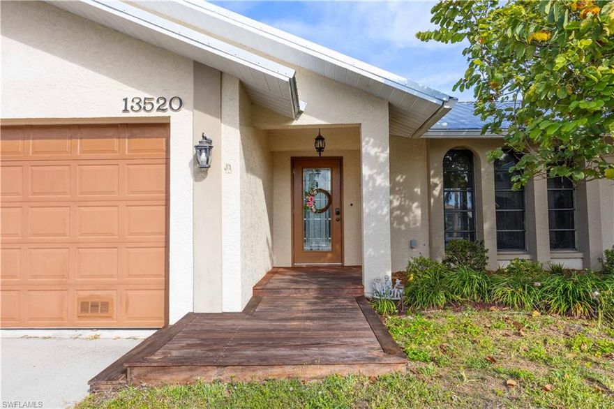 WELCOME HOME! This wonderful three bedroom with den home has, two and a half baths and is in the sought after neighborhood of River Forest. It's onlt 10 minutes to the river, and from there it's a straight shot to the Gulf. Or maybe just stop and anchor at the Lighthouse Beach on Sanibel Island to play/relax. 
This home has been completely remodeled.. All of the appliances, flooring, quartz counter tops, paint, HVAC system, and primary bath tile work are new, as are all of the fixtures. Wood patterned luxury vinyl flooring throughout is new as well. The metal roof was replaced about 6 years ago with a long life ahead. 
This beautiful property sets back from the private road in a small cul-de-sac with only one neighbor directly next door. With a family room, living room and a huge, partially covered patio screen room, there's plenty of room for the family to stretch out. This home sits on the southern edge of the main canal to the north side with a smaller canal on the east side: the view is spectacular! there is a distinct tropical feeling to the back yard with lush plants, palms, and a beautiful live oak. The dock was re-decked a couple of years ago and is big enough to hold a dance on AND tie off a 40+foot boat. The split bedrooms work out very well for families, every one with walk-in closets. In addition to the three bedrooms there is a 10 x 12 den/office adjacent to the primary bedroom. The attached two car garage with automatic door and lights is a 'must-have'. To top it all off, there's a great workshop/shed with just under 200 sq. feet for projects, 'tinkering' or extra storage. The listing Realtor has been to many sit-down holiday meals in the screen room for 25-50 people. It's an amazing setting, with a beautiful view, while listening to fish jumping. You will see manatees, porpoises, tarpon, etc., in the warmer weather, but there's always something to see. The current owner has a large school of Tilapia that are used to being spoiled with a few hands full of cat food It is truly a beautiful place to relax. There is an HOA which doesn't do much more than collect $19 per YEAR for road maintenance. There is another HOA on the Island, at the end of the road, that can be joined for approximately $200 per year which allows for the use of their clubhouse, and is completely voluntary. This is truly a "must see" property.