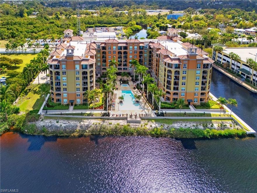 TURNKEY! Alta Mar is an exceptional waterfront community on the Caloosahatchee in the vibrant riverfront district of Fort Myers! Enjoy open water views while relaxing at the community pool and the convenient trolley service from your front door to downtown Fort Myers! Step inside this fully furnished luxury 2 bedroom, 2.5 bath 6th floor condo to find a beautifully designed space with 10’ ceilings and 8’ doors, offering an open floor plan that seamlessly connects each area. The home showcases contemporary neutral décor with crown molding plus laminate and tile flooring. Enjoy the spacious living area that opens to a lanai through impact-resistant sliding doors, perfect for enjoying canal and city views. The modern kitchen is a chef’s delight, featuring light cabinetry, granite countertops, a stylish tile backsplash, and stainless appliances, all centered around a convenient island. Both bedrooms are primary suites, each with walk-in closets and private baths, providing you with ultimate comfort and privacy. This condo includes fantastic amenities such as Phyn water monitoring system which provides alerts for any leaks and is controlled remotely from an app on your phone, new central AC and heating, a washer/dryer in the unit, and two parking spaces—one covered under the building and another on the garage roof. The community spoils you with incredible features like heated pool with stunning river views, a spa, a gym, a library, common outdoor space, and grilling area. Great location minutes from downtown Fort Myers, offering fine dining, abundant shopping options, plus fishing and boating on the river. Cable, internet and water are included in your monthly fee, making life even more convenient. Don’t miss this opportunity! Schedule your private showing today!