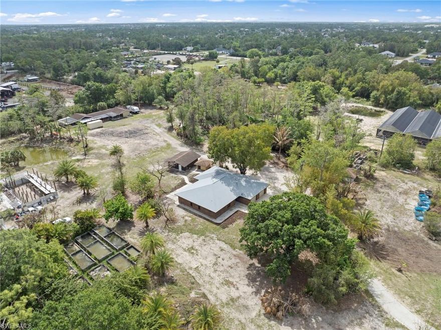 SALE INCLUDES BOTH LOTS total of 10 acres including STRAP #19-44-26-07-00034.0000 
(MLS Listing # 226014667) MUST SEE! 
Rare opportunity to own 10 private acres in Buckingham—one of Fort Myers’ most sought-after rural communities—offering the perfect blend of privacy, functionality, and income potential. Over 50% of the land is elevated, non-flooding pasture, making it ideal for horses, livestock, or a variety of agricultural uses, while a fully permitted 14,400 sq ft Connely greenhouse currently used for aquaculture production presents an exceptional opportunity for income generation or alternative farming ventures. The property is supported by three wells (one primary and two auxiliary) and includes transferable SWFWMD water use permits (buyer to verify). The beautifully remodeled 2,700 sq ft red brick home features updated A/C, modern cabinetry, new countertops, upgraded flooring, and brand-new appliances, along with a roof under three years old that is fully permitted for added peace of mind. Surrounded by mature oaks, pines, and lush natural vegetation, the setting is both serene and private, with a natural cypress windbreak providing storm protection while attracting native wildlife and migratory birds, all just one block from the 1,000-acre Buckingham Strand with miles of scenic hiking and riding trails. The property also includes multiple ponds that support aquaculture and natural drainage, including a large private pond behind the home ideal for fishing or relaxing, as well as a pole barn with a bathroom, tropical bamboo, exotic palms, and fruit trees, plus an approximately half-mile perimeter trail perfect for walking, horseback riding, or ATV use—making this truly a one-of-a-kind property with endless possibilities for rural living, recreation, or agricultural business. Call today to schedule your private tour.