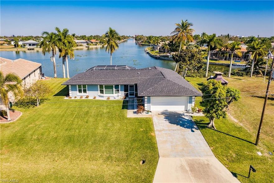 WHAT A VIEW! Completely updated Home on Shamrock Lake looking down an intersecting Freshwater canal with approximately .83 Mile water view, possibly the longest canal view in Cape Coral. Shamrock Lakes is 4 Connected lakes that offer the Best Freshwater boating in all of Cape Coral! So much is new in the last 3 years hard to list it all! Start with all the Mechanicals Roof, Gutters, Attic Insulation, PGT Hurricane Impact Windows and Sliders, A/C and Air Handler, and Hurricane Resistant Garage Doors. Then lets move to the Outside Area Pool Refinished, LED Multi Color Pool Lighting, Pool tile, Pool Heater, Pavers in Pool Area, Sunning Area, and Dock, Outdoor Shower, Sod & irrigation system and landscaping. Inside the Kitchen has New Granite Counter Tops, New Granite Composite sink, Touchless Faucet and Disposal. Updated Bathrooms with ADA compliant Toilets, freshly painted interior, Ceiling fans, Fiber Optic Internet and oversized 2 Car Garage with storage shelves. Did I mention the Views!