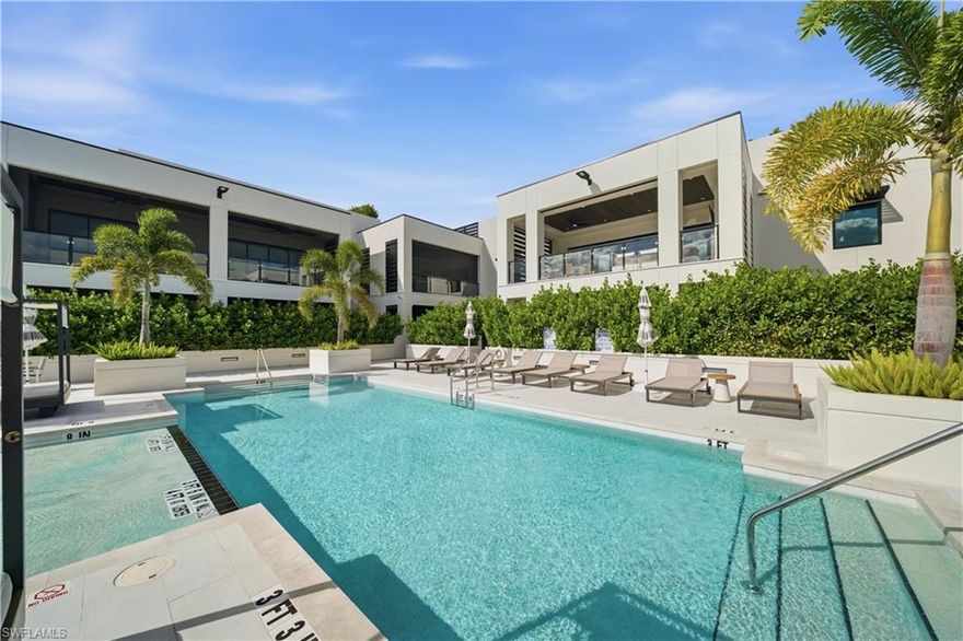 WALK TO 5TH AVENUE/DOWNTOWN NAPLES! A true one-of-a-kind! Welcome to Stella Naples, where luxury meets exclusivity in the heart of Olde Naples. Built in 2024 with only nine total residences (each with their own PRIVATE ROOFTOP DECK), this newly constructed boutique building redefines upscale, low-density living, just steps from the world-renowned 5th Avenue South, historic Downtown Naples, and the white sandy beaches of Naples. Unit 301 is an extremely unique residence consisting of two units that were combined during original construction and offers nearly 4,100 square feet under air, 4 bedroom suites (each with a private ensuite bath), den, music room, 4.5 baths, two covered lanais (with motorized roll down privacy/bug screens) each with their own gas fireplace, and FOUR DEEDED PARKING SPACES underneath the building. This tastefully designed top floor, end unit condo offers an open concept floor plan with 10’ ceilings, 4 sets of sliding glass doors to the two lanais, and rich wide plank European White Oak wood floors that flow throughout. The Kitchen has been outfitted with custom Ruffino cabinetry, Cambria quartz countertops, top of the line appliances including a 48” eight burner GAS Viking range and Sub-Zero refrigerator/freezer. Just off the Kitchen is a generously sized walk-in pantry with Miele speed oven. The impressive wet bar is complete with a wine cooler, ice maker, and ample bottle/glass storage. The impressive primary suite features its own private lanai with gas fireplace, separate his & hers walk in closets with custom shelving/drawers, auxiliary washer/dryer, music room with hidden storage closet, bath with oversized shower & free standing soaking tub, and a private den. Accessed from within the condo, the private 1,000 sq ft roof top deck is the perfect spot to enjoy the Naples sunset or entertain family & friends around two fire pit areas or outdoor kitchen complete with a gas grill and refrigerator, creating the ultimate setting for sunset cocktails before dining at one of the many iconic restaurants here in Downtown Naples. A long list of special features can be found throughout: motorized shades on all windows; custom window treatments/curtains; custom wallpaper details; recessed lights in all rooms; reverse osmosis water filtration system; in-ceilings speakers; 8’ solid core doors with Emtek hardware; stained cypress wood ceiling accents on the lanais; custom Ruffino cabinetry with Cambria countertops; designer Brizo, Rohl & Kohler bath fixtures; and more! Residents of Stella Naples enjoy an exclusive collection of amenities, including a sunny Southern-exposure 24/7 heated pool, state-of-the-art fitness center with an outdoor turf area, and an elegant club room. The building also provides four deeded parking spaces, ample guest parking and state-of-the-art security, featuring facial recognition technology and smartphone-integrated video access panels. Experience the finest in Downtown Naples luxury living at Stella Naples.