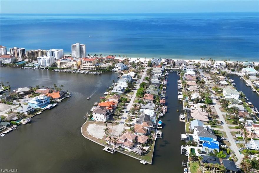 THIS IS THE ONE! Primium Lot. The  Best wide and long water view with Gulf Access in the most desirable location in Conners Vanderbilt Beach. One block distance to the beach. This is your opportunity whether to keep or build a new dream home in this unique water front property conveniently located close to fine restaurants, shopping centers and many more. This property is "SOLD AS IS "