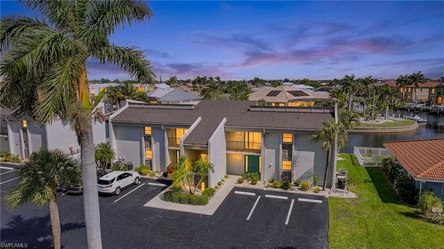 Welcome to the desirable deed restricted community of Punta Gorda Isles! This TURNKEY TOP FLOOR 2 bedroom 2 bath condo comes with your own private, deeded dock, with a 6,000 lb boat lift, perfect for embracing the Florida boating lifestyle. Inside, you’ll find a bright, open floor plan with tile and vinyl flooring throughout. The spacious living room flows seamlessly onto an oversized screened lanai, creating the ideal space for indoor-outdoor living while enjoying peaceful canal views. The kitchen is both functional and inviting, featuring granite countertops, tile backsplash, white appliances, and a breakfast bar—perfect for casual dining or entertaining. Designed with privacy in mind, the split floor plan offers a comfortable retreat for both owners and guests. The primary suite includes two built-in closets, an en-suite bathroom with a walk-in shower, and private access to the lanai with beautiful water views. The large guest bedroom also features two built-in closets and is located near the guest bathroom, which includes a tub/shower combination. A hallway linen closet adds extra storage convenience. Step outside to your screened lanai overlooking the canal—an ideal spot for morning coffee or evening relaxation. Boating enthusiasts will appreciate direct access to Charlotte Harbor and the Gulf of Mexico right from the private dock and lift. Additional highlights include: New water heater (2025), 2024 metal roof, 2024 building exterior paint, and two assigned parking spaces come with the condo! Situated on a quiet cul-de-sac street, this well maintained complex offers a large heated community pool and offers convenient access to shopping, dining, medical, entertainment, Fishermen's Village, community parks, and so much more.