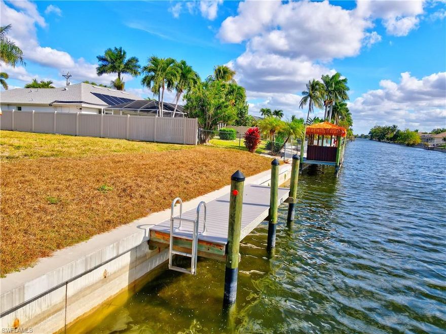 Build your dream home on this .26-acre waterfront homesite located on a quiet freshwater canal in Cape Coral, Florida. This property features a brand-new dock and a brand-new seawall, offering immediate waterfront enjoyment and long-term peace of mind. With southern exposure, enjoy abundant natural light and stunning sunset views year-round.
All city assessments are paid, adding significant value. Conveniently positioned with easy access to Fort Myers, just minutes from Veterans Parkway and Santa Barbara Boulevard, this location makes commuting and daily errands effortless.
Golf courses, shopping, dining, parks, airports, and Southwest Florida beaches are all nearby. Surrounded by newer homes in a growing area, this lot is perfect for a primary residence, vacation home, or investment opportunity. A rare chance to own a move-in-ready waterfront lot with major improvements already in place.