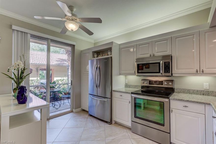 Sought after, well maintained FIRST FLOOR condo with long lake views, fountain and bridge leading to a tropical island in the well established subdivision of Rosewood. The exterior of Rosewood has recently received NEW roofs, gutters and down spouts. The landscaping is lush and outstanding! This 2BR/2B property has two spacious lanais which provide enjoyment on the rear lanai, an east exposure, for morning coffee and the front lanai in the late afternoon for sunsets and cocktails. Both lanais have electric storm shutters. As you enter the condo you immediately notice the 20" tile on the diagonal throughout the entire condo including both lanais. Kitchen has been upgraded featuring 3 cm. granite and stainless steel appliances. Other upgrades include the guest bedroom and bath suite made private for your guests by a pocket door, teak closet shelving and crown molding throughout the living areas. The condominium association fees are among the lowest in the complex at $1377 per quarter. The amenities include the amazing 11,000 SF tropical pool, clubhouse, clay tennis courts and bocce. Location is convenient to the beach, restaurants and shopping. This is a MUST SEE CONDO, BE FIRST!