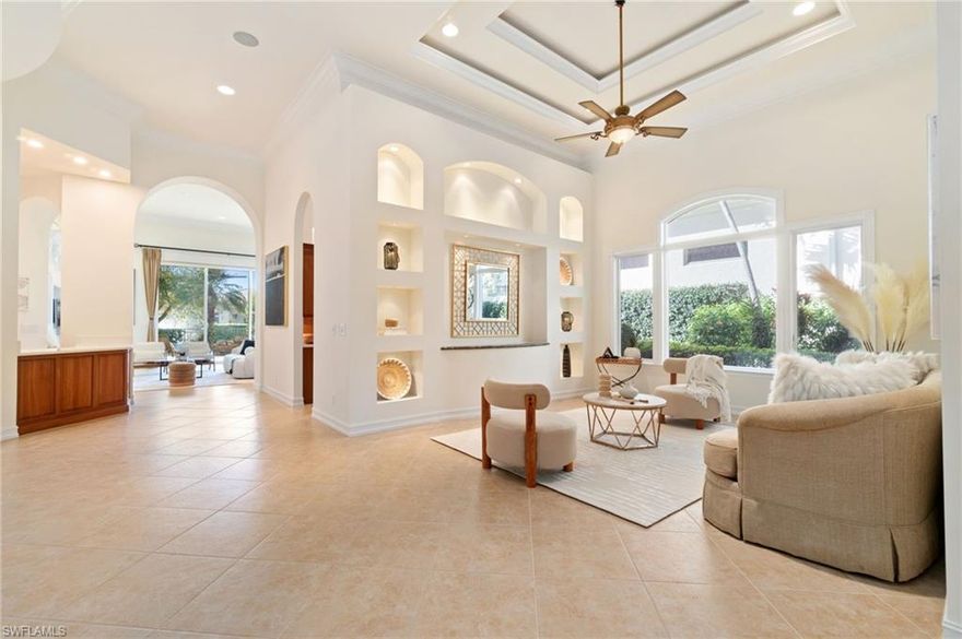 Don’t miss this rare opportunity to own a custom-built, elegant home in the prestigious gated community of Terrabella. Boasting stunning southern lake views and meticulous craftsmanship, this 3-bedroom, 3.5-bath residence offers unparalleled luxury. Highlights include a formal living and dining room, a cozy family room, and a versatile custom office/den. Designed with exquisite attention to detail, the home features a grand entry foyer, sweeping archways, triple crown molding throughout, and a custom wet bar perfect for entertaining. Relax and enjoy serene lake and fountain views from both the family room and the luxurious primary suite. The chef’s kitchen is a standout with its breakfast bar, open design, and cozy breakfast nook that flows seamlessly into the family room. Outside, your private oasis awaits: a heated pool, summer kitchen, and lush tropical landscaping provide the ideal setting for outdoor gatherings. Nestled within Pelican Marsh, an amenity-rich, gated community, residents enjoy access to a world-class tennis program, fitness center, bocce, pickleball, and the private Pelican Marsh Golf Club with optional memberships. Located in the heart of North Naples, this home is just minutes from upscale shopping, Trader Joe’s, Whole Foods, and the area’s renowned white sandy beaches.This is luxury living at its finest.