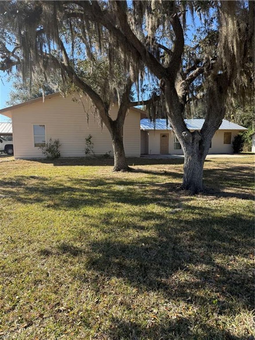 Beautiful property located in Lakeport, 5 miles from Lake Okeechobee, 10-15 minutes from Casino. Home has a brand new roof (2025), new 4 ton A/C unit (2025), New outside paint (2025), Range is 1 yr old. This property has a barn, fenced in area for horses or livestock with a pond. You also have two covered carports, one can be used for recreational vehicles. There is also many out buildings with one that can be used as a workshop. Also a really cute little building with a porch that can be used for cooking and Family gatherings with a picnic area and an "out house"! Plenty of room for the Family. Wild game and deer have been sited on the property. This is truly a beautiful piece of property away from the City. Don't let this one get away!