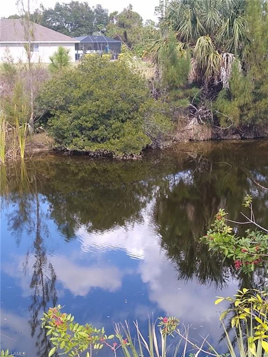 80 foot canal lot in northeast Cape Coral, new homes in area.