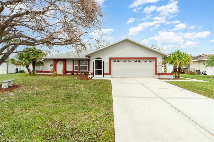 Beautiful 3/2 with newer kitchen featuring Gray Shaker Cabinets, Stainless Appliances, Granite and custom lighting. Split bedrooms with no carpet in the house anywhere!  Laminate and tile throughout.  Ceiling fans in LR and DR are combo light fans that look more like custom lights than fans, yet move a lot of air and are also remote controlled.  Inside laundry which means no musty clothing in the garage.  Granite in baths as well.  Large back yard with a gorgeous live oak tree and screened patio to enjoy the outdoors.  Centrally located near shopping, dining and easy access to the midpoint bridge to Fort Myers.  Per Seller and Sellers Disclosure, this home did not have any hurricane damage.