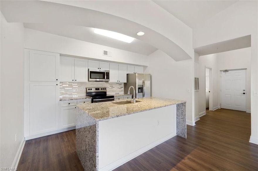 Come visit this Beautifully Updated Condo in North Naples at Fairway Preserve! This 3/2 Condo lives BIG with vaulted tall ceilings and 1500 sq. ft. of living space. The 3rd Top Floor Location ensures No noise above you and privacy! You will fall in love with the beautiful cascade waterfall granite countertops, newer stainless steel appliances, newer AC, Roman soaking tub, and expansive patio with lakeview water feature. Even better, this unit comes with 1 detached garage, 1 detached carport, and 1 blacktop space! This gated community features a pool/jacuzzi, exercise room, clubhouse, indoor racquetball, and carwash area. Pets Permitted and walking trails in forest are at back of complex. Low Fees of only $1,050 a quarter include wifi-internet, recreational pool facilities, pest control, and valet trash pick up at your door. Fairway Preserve is conveniently located just 8 miles to the beach, 2 miles from I-75, and plenty of shopping and restaurants within a 1 mile range. This unit is waiting for its new loving owner, so come visit today to make this condo yours!