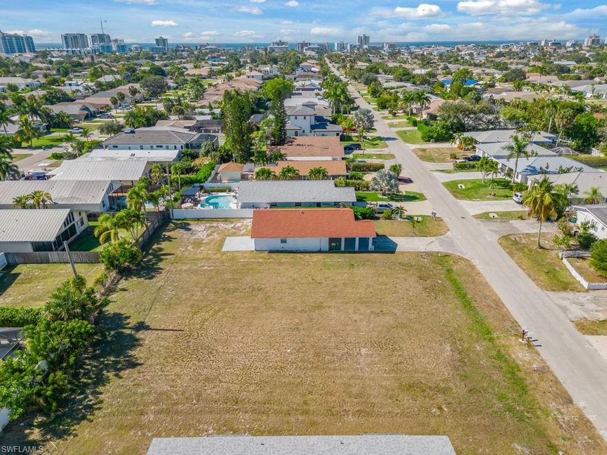 Discover a rare double-lot opportunity in the heart of Naples Park, one of North Naples’ most desirable and flexible residential communities. With no HOA, this oversized 0.31± acre parcel offers exceptional development potential—ideal for a custom single-family home, duplex, or multi-family project. Located west of US41, the property sits just minutes from Vanderbilt Beach, Delnor-Wiggins Pass State Park, and the vibrant dining, shopping, and entertainment options at Mercato, Whole Foods, and nearby coastal hot spots.