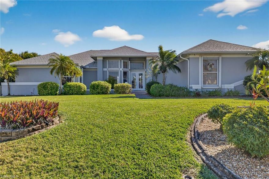 Live a great Southwest Florida waterfront lifestyle in this spacious large open floor plan home on an oversized corner lot.  Large volume ceilings with a magnificent waterfront view all the way down the canal with no one looking directly into the back of your home.  The exterior of the property has had many updates including new roof, soffits, gutters, aluminum pool enclosure, exterior paint and some landscaping. Along with manual hurricane shutters on all windows.  The interior of the home is clean and ready for someone to transform its design into their own!  Outstanding features include high ceilings, many windows letting in lots of natural light, a functional and split layout with a bathroom connected to each bedroom (2 potential owner suites and 2 bedrooms with a shared bathroom), along with a separate pool bath, and did we mention a magnificent waterfront view. The beautiful pool and brick paver pool deck offers oversized outdoor party space, along with a great boat dock and a 7k boat lift ready to accommodate your boat and become your gateway to the Gulf of Mexico. This homes water front location offers a beautiful scenic and nature packed ride to the Gulf of Mexico's open water in roughly 30+ minutes.  This property offers a great opportunity for someone to continue transforming the interior into the million dollar home it has the potential to be! The sellers have loved this home but are now looking to downsize and passing the upside potential opportunity on to a future homeowner.  This home is located in a area of beautiful homes and overall peace and tranquility in SW Cape Coral and did not have interior flooding through any storms.