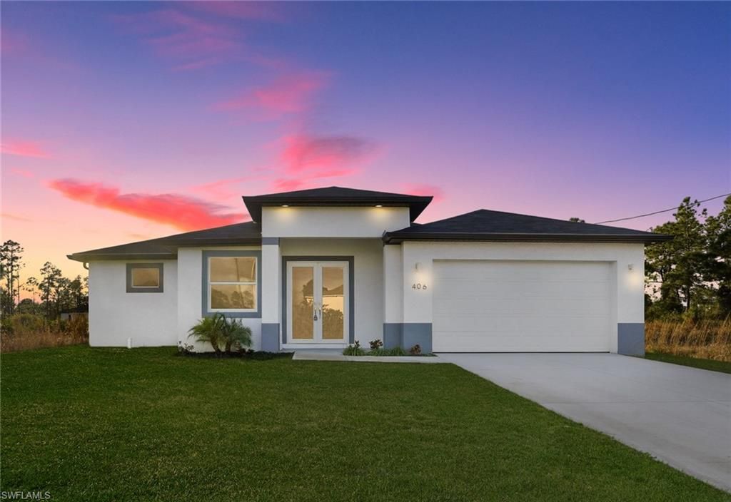 Photo of 406 Genoa AVE S, LEHIGH ACRES, FL 33974 (MLS # 226005326)