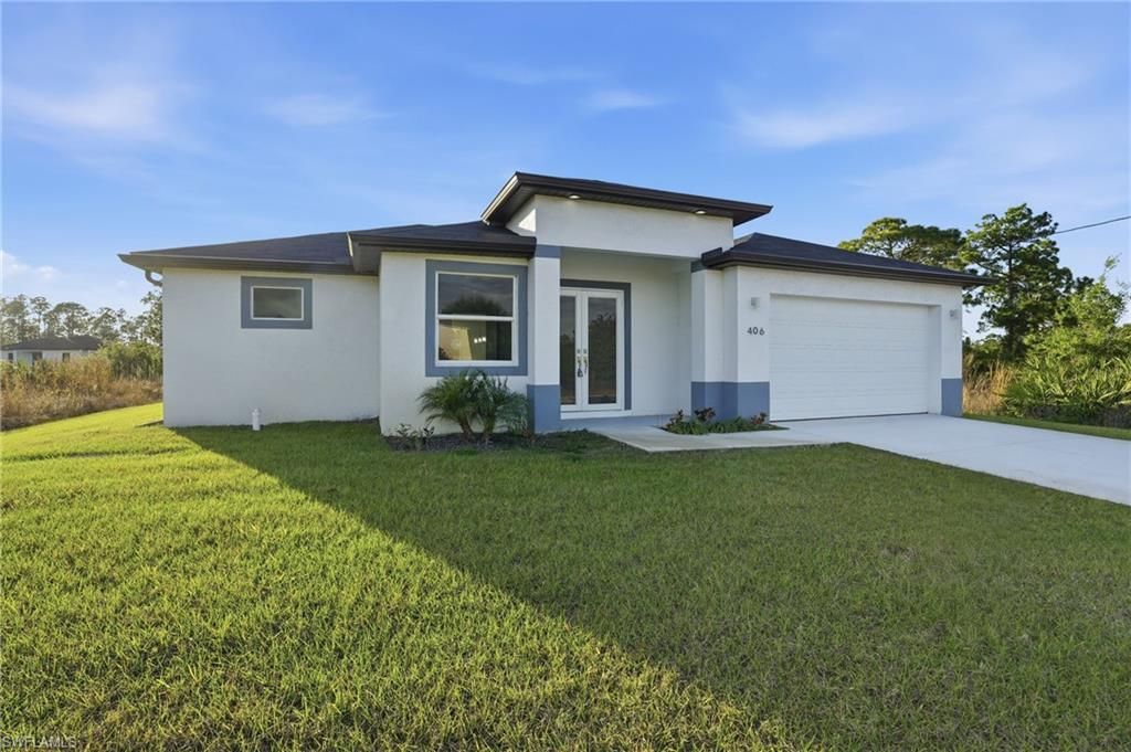 Photo of 406 Genoa AVE S, LEHIGH ACRES, FL 33974 (MLS # 226005326)
