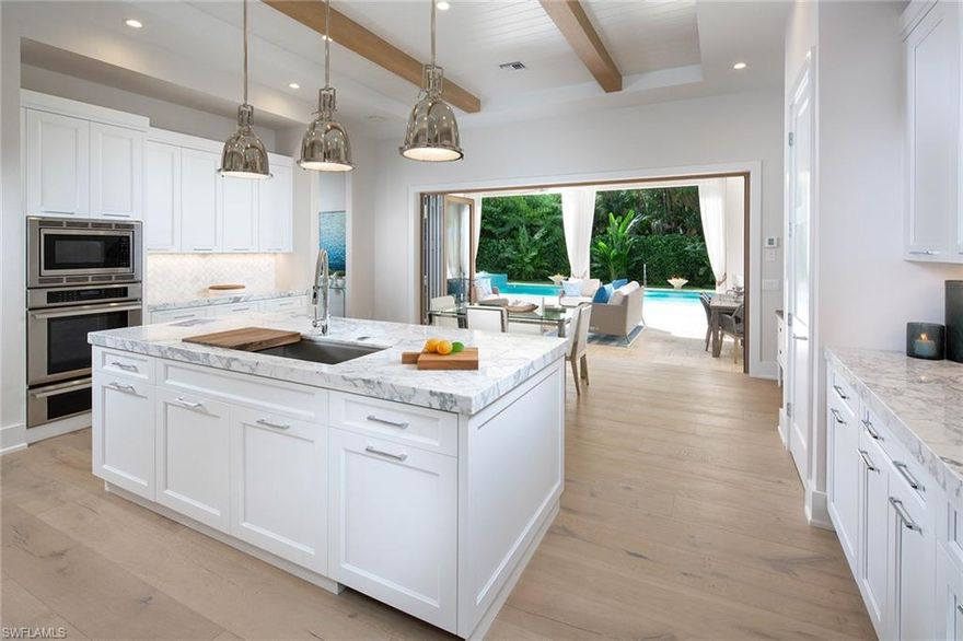 Perfectly situated on an oversized lot with ample space to relax and enjoy the outdoors, this new construction Olde Naples home is a dream.  Coveted southwestern exposure fills the home with natural light while the newly refreshed design by Montana and associates offers a coastal chic flair. The two-story great room plan with 4 bedrooms plus den lends itself to any lifestyle.  Crafted with meticulous attention to detail, residents will appreciate the custom wood bi-folding doors, Ali Kriste cabinetry, Calcutta gold stone countertops, Sub-Zero and Thermador appliances and a 300-bottle wine cooler found in the butler’s pantry. An expansive outdoor living area features a kitchen, two fire features and a sparkling pool and spa.  Centrally located close both the white sandy beaches and hustle and bustle of downtown make this the ideal Naples oasis. Check out the video on Vimeo or in the Virtual Tour link.