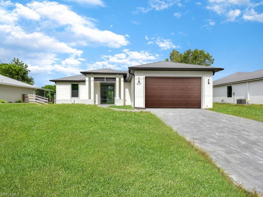 NEW CONSTRUCTION SINGLE FAMILY HOME ON A LARGE LOT WITH NO ASSOCIATION DUES! This AVAILABLE home has a completion date of February 11, 2022 and will be ready to close with your buyer on that day. The home is a 3 bedroom + large den with a closet and 2 designer spacious bathrooms. This home comes standard with a metal roof and impact windows & doors! Gorgeous contemporary layout w/ open concept kitchen, split bedroom floor plan, luxury plank flooring throughout, quartz countertops, contemporary double door front entry, large slider system on rear of home, laundry room w/ utility sink, volume ceilings, walk-in closet & frameless shower enclosure in master bath, and 2-car garage. You will love this amazing home with top quality construction!