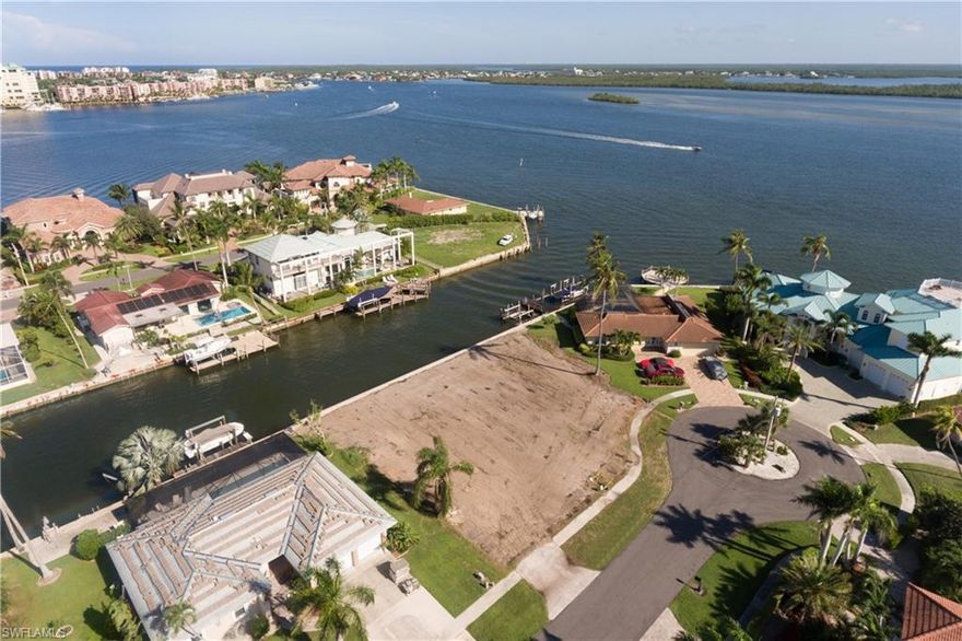Amazing waterfront lot on beautiful Marco Island with partial Marco River views and direct water access for under a million!!! This property is oversized with 128 feet of water front (standard lot size is only 80 feet of waterfront), making it perfect for a huge boat and/or water toys.  Located just one house from the Marco River, this lot has quick access to the Gulf and to the Marina!   The house was demo’d August 2017, allowing for big savings on impact fees (approx. $30-40k depending on new house size).  You can start to build your dream home after closing and will not have to wait for a new seawall, valued at over $40,000, was completed August 2018.  Northwestern exposure gives the pool area sun throughout the day and gorgeous tropical sunsets.
