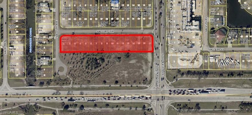 Rare find, 1.99 acre commercial corner site facing Veterans Parkway in rapid growing SW area of Cape Coral.  This unique shaped site is long and narrow with 693' of street frontage on SW 23RD Terrace. The site would be an excellent fit for a multi-tenant neighborhood shopping plaza to service the surrounding area.  The property in front of the site is County Owned Right of Way insuring that the site will always maintain excellent visibility from Veterans Parkway.  The site has City water, sewer, and irrigation.  Buyer to assume assessment balances at closing.  The seller will consider owner financing for a qualified buyer.