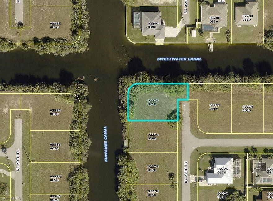 This property sits right on the corner of an intersecting canal of Suwanee canal and Sweetwater canal.  Huge lot right on the end of the street to build your dream home!  This freshwater canal can provide lots of fishing and kayaking.  Beautiful lot situated in the oh so ever growing Cape Coral! You have a plethora of options for dining, shopping, and close to downtown Fort Myers.  This property will not last long!