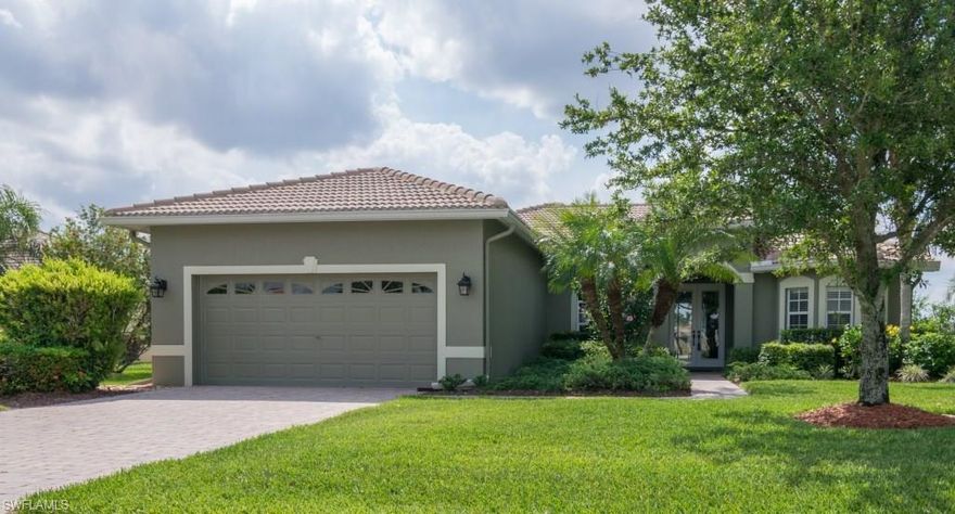This home is located on an executive lot overlooking a 89 acre lake. It is on the most desirable street in Valencia Lakes. The kitchen was extensively renovated, featuring white shaker cabinets and beautiful Italian marble counter tops. The kitchen sink is a stainless steel sub-zero and the open concept highlights the large living room. Crown molding was recently installed in the main area of the home. There are many windows which view the gorgeous lake. The lanai is over-sized for relaxing evenings to observe the beautiful sunsets. It is only minutes to the new Publix.