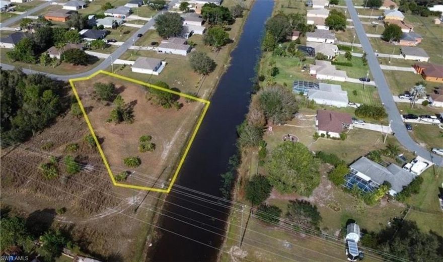 *Oversized Waterfront Lot with Canal Views - Ready to Build!* Discover the perfect canvas for your dream home on this expansive *0.69-acre waterfront lot*! Situated along a serene canal, this cleared lot is ready for you to build your dream home. Offering access to city water and sewer, the property provides a seamless start for construction. It's prime location near SR82 ensures easy access to shopping, dining, schools, and major highways. Don't miss this opportunity to own a stunning waterfront property in a convenient and highly desirable area!