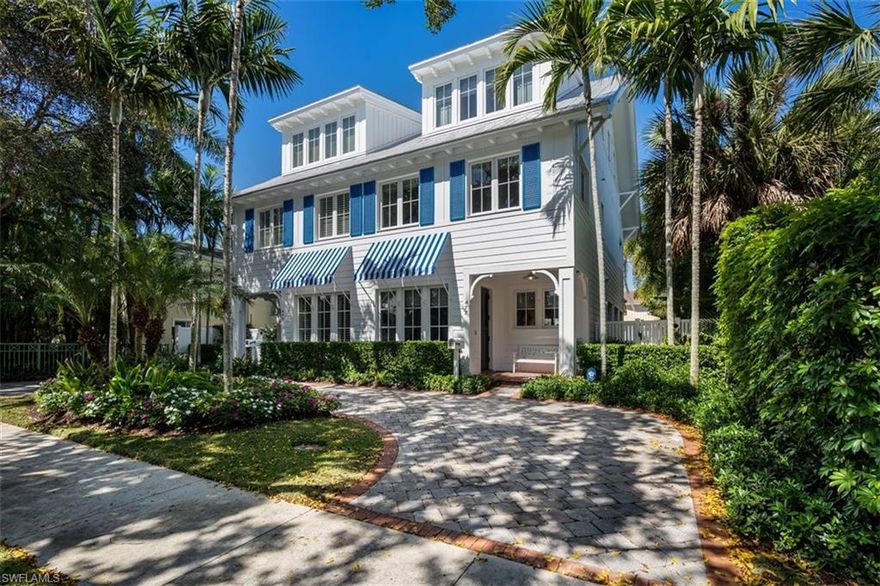 V1378 - Beach Bungalows of Naples! Spectacular! Located 4 blocks from the beach and 2 blocks from 5th Avenue, this charming Old Naples residence combines wonderful architecture with beautiful decor. Light and airy, features include oak flooring, high-end appliances, new mechanicals, custom cabinetry, and an extensive list of additional upgrades. Private en-suite guest bedrooms. Open the sliding doors to an amazing outdoor living area with fireplace, grill, and large seating area around the courtyard pool. A private studio sits atop the garage with access from the alley offering great guest parking. Designed by renowned architect Harrell and Co. Nautical blue and white striped awnings reflect the vision of Old Florida.